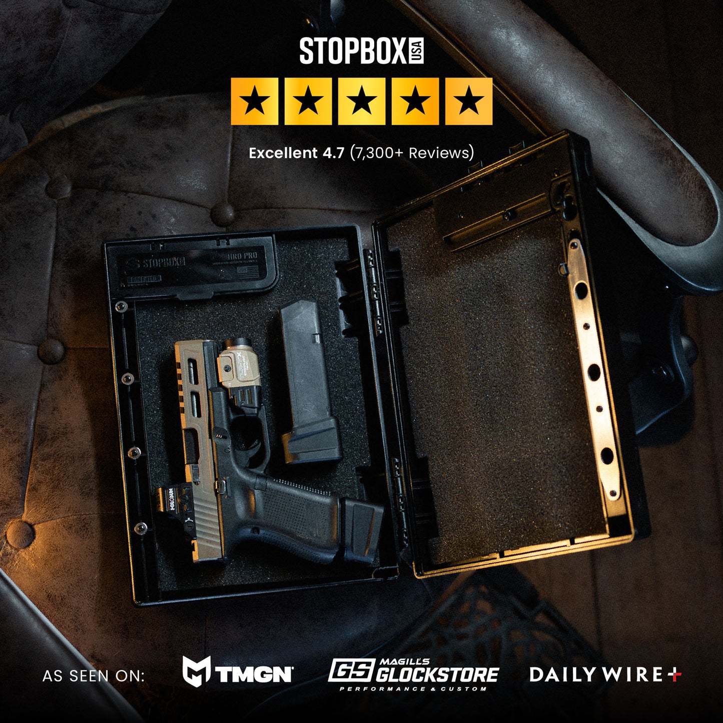 STOPBOX PRO with a handgun inside a secure case, featuring a black interior and gold accents, displayed on a leather surface.